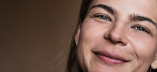 Portrait of young woman before skin retouching.